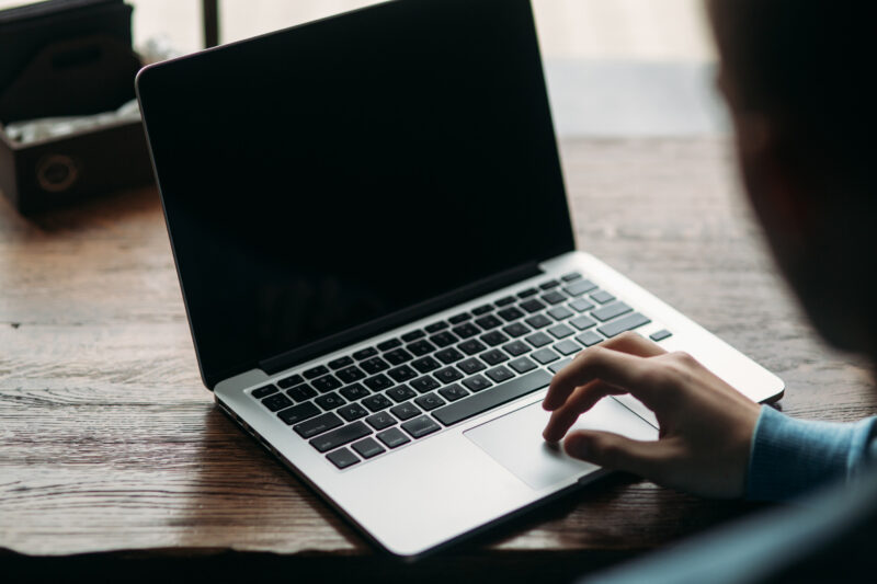 person typing on laptop